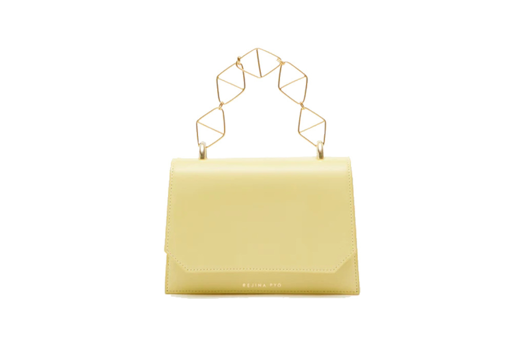 Yellow bag with gold geometric handle