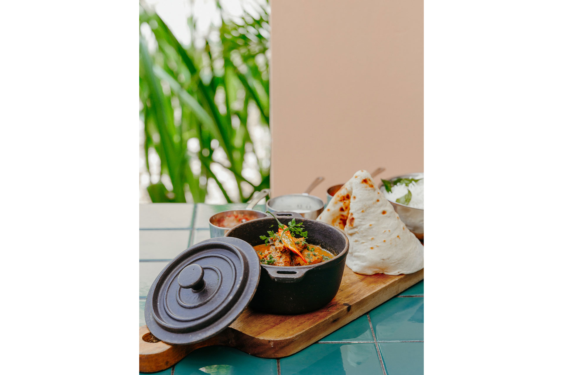 Wooden board with a selection of Mauritian cuisine 