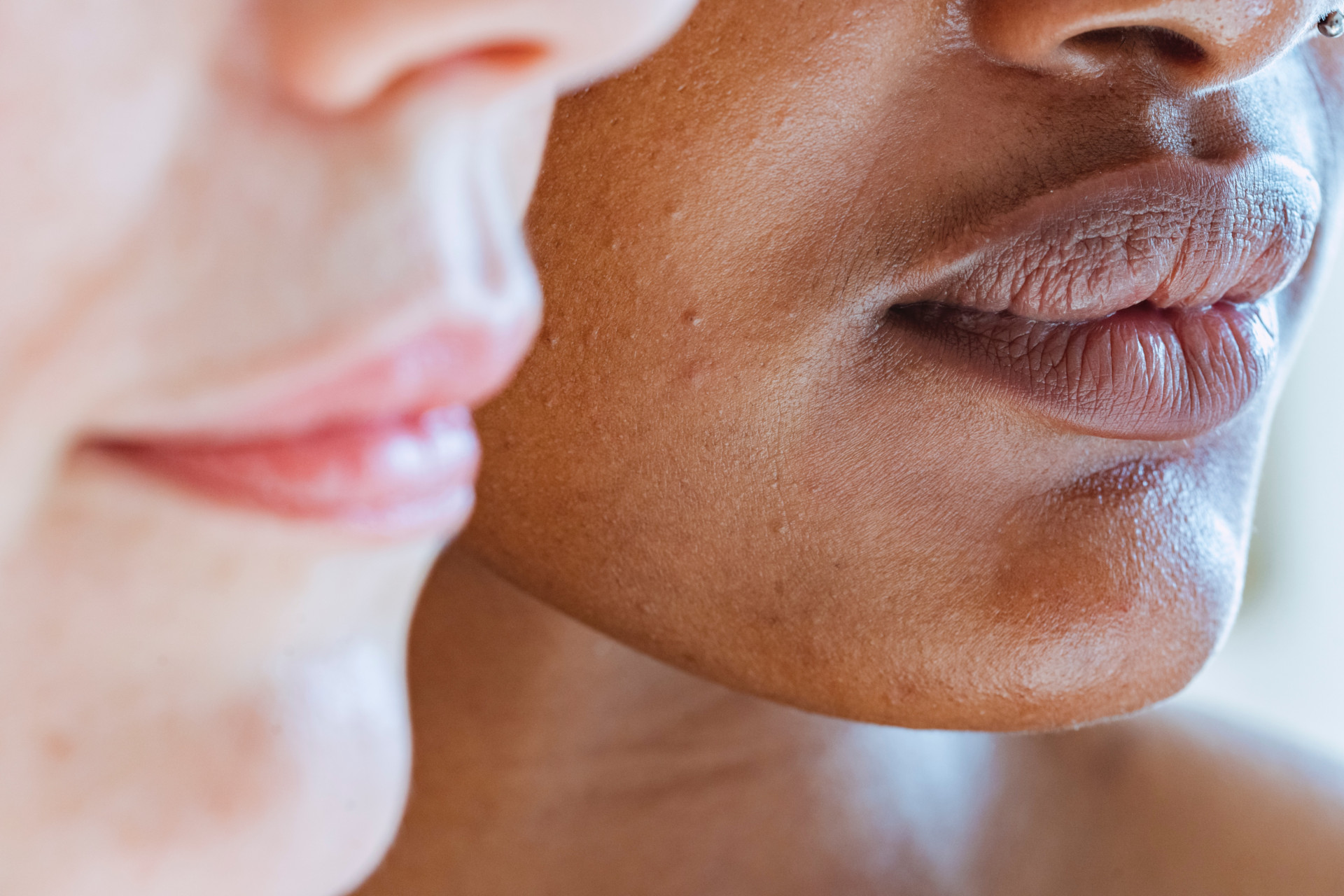 Close up of two women's lower faces