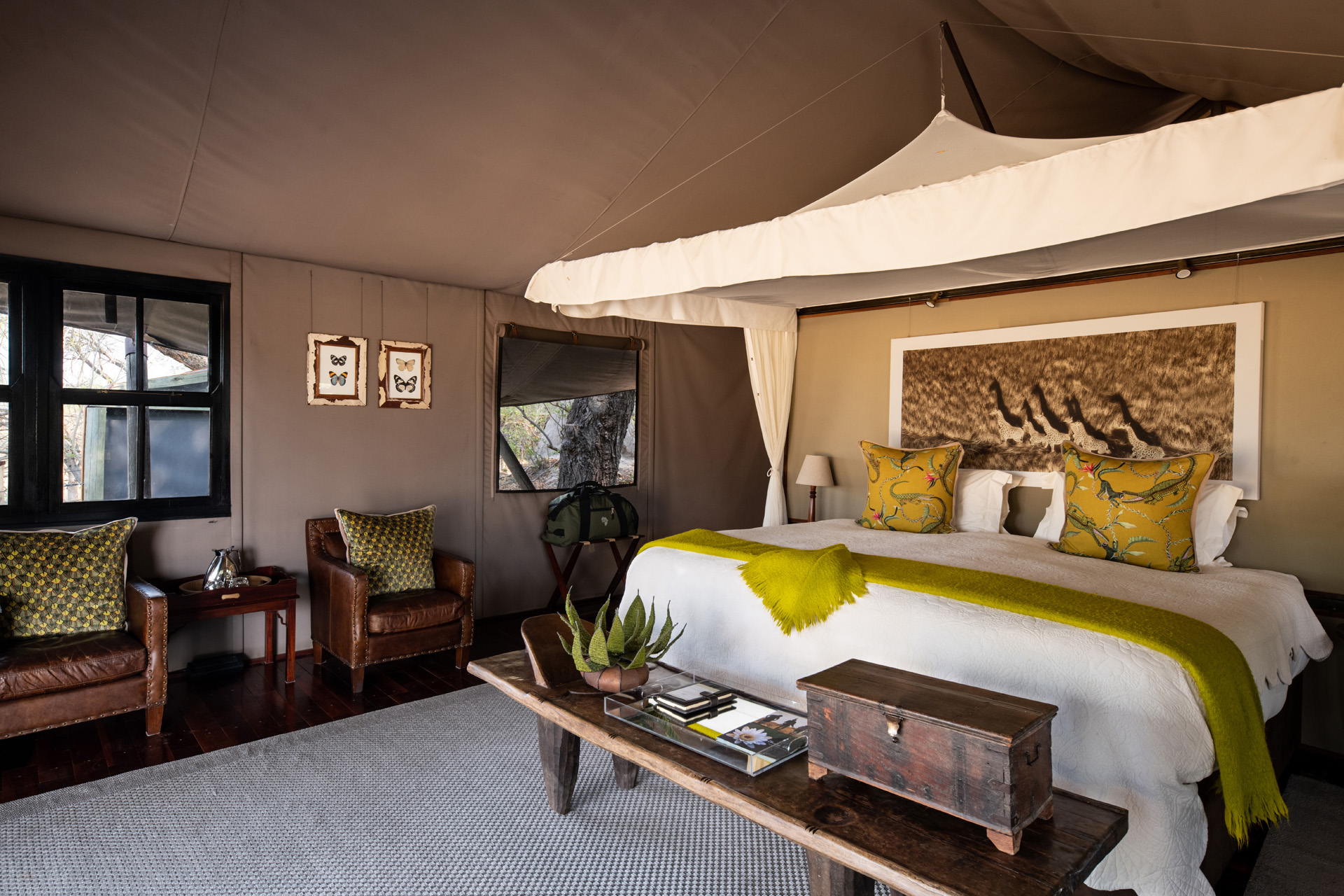 A bedroom with canopy bed at Wilderness Chitabe