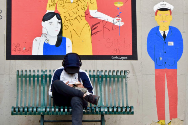 French man listening to radio on headphones