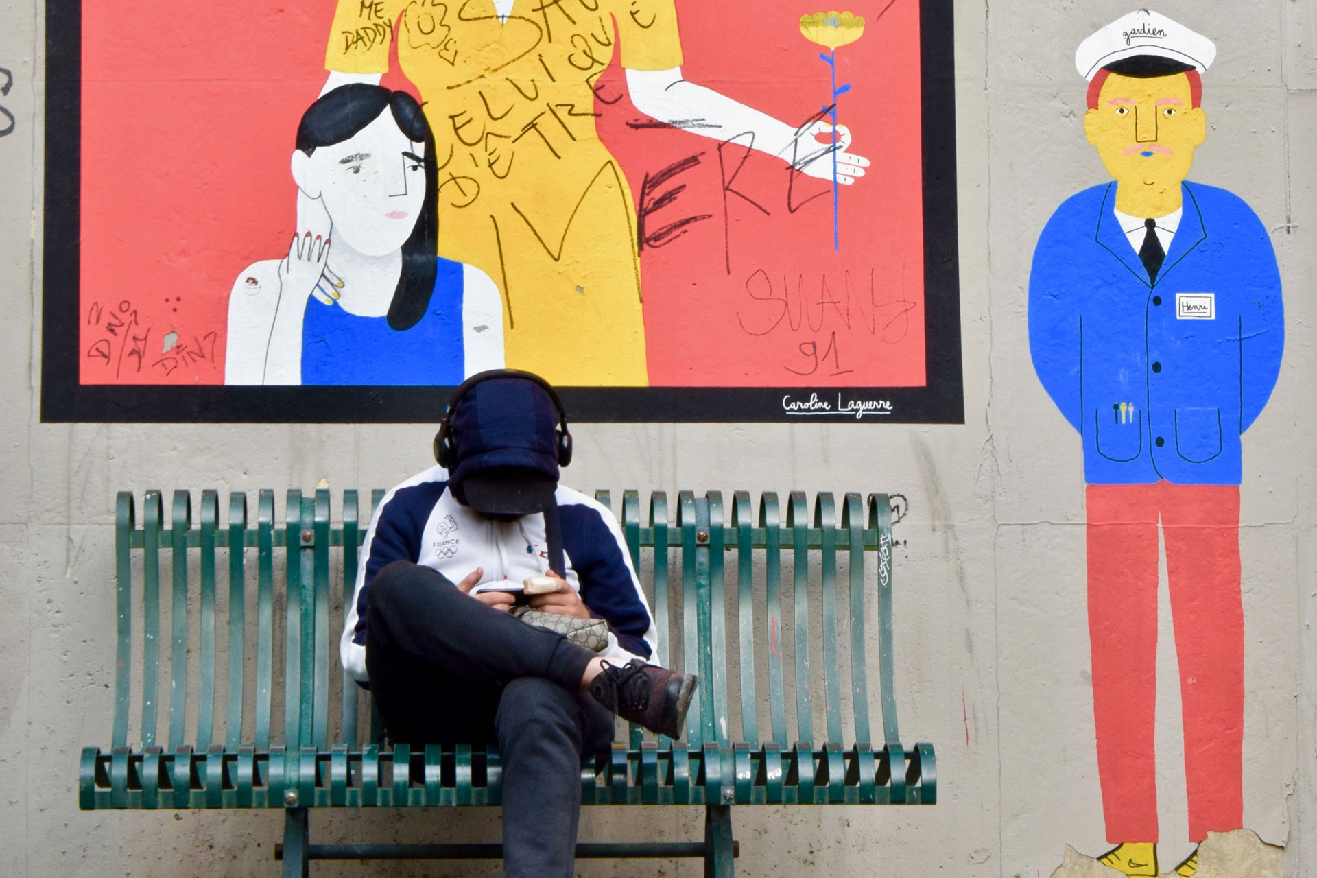 French man listening to radio on headphones