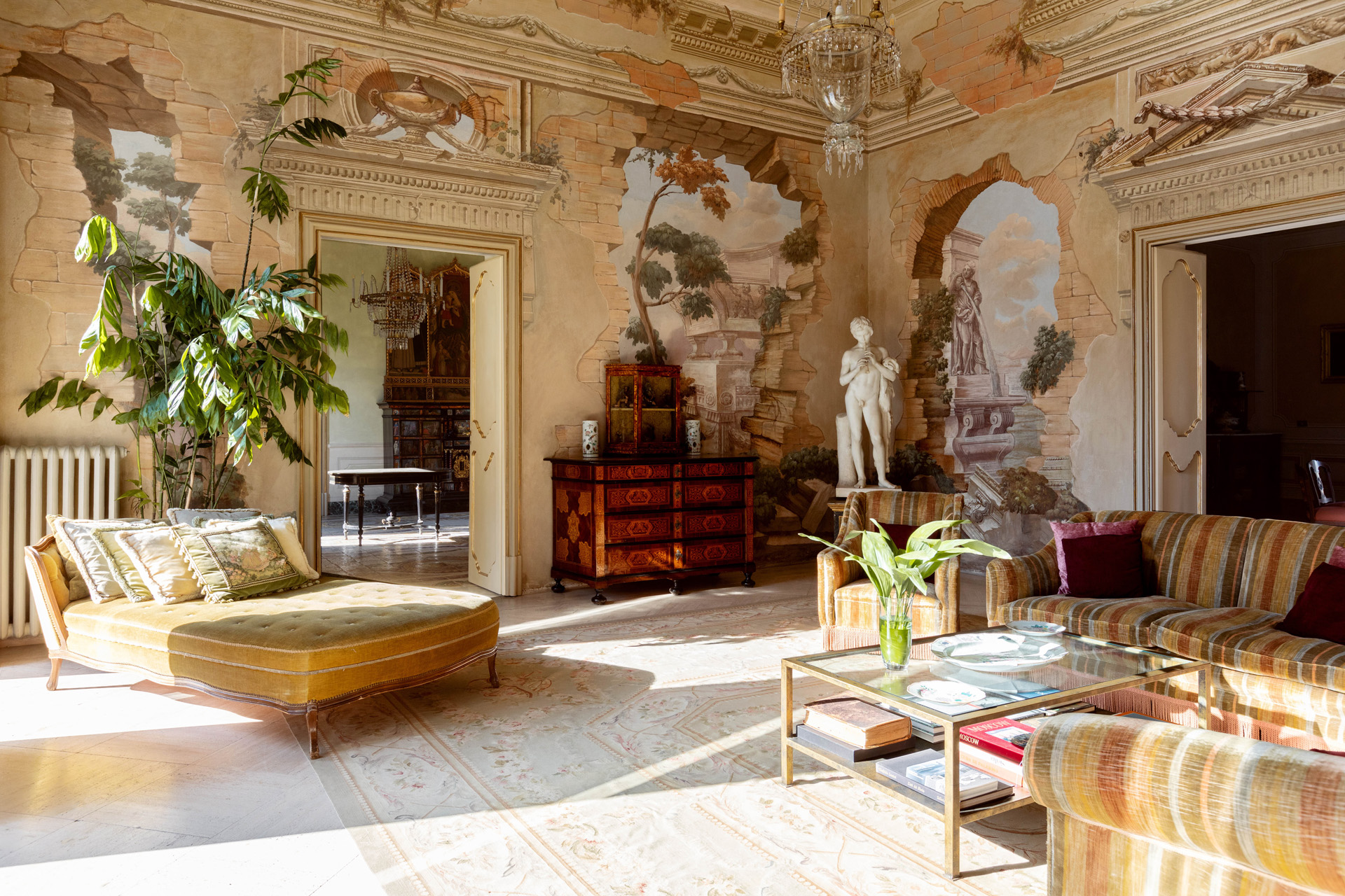 An ornate room in Villa Tasca will the sun pouring in