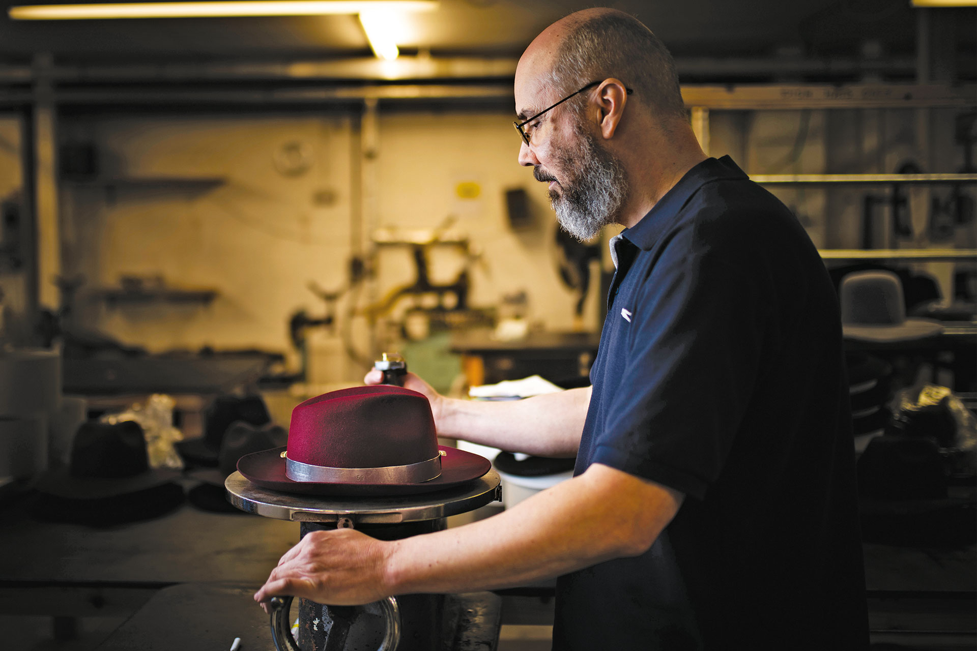 Man crafting a Christys' Hat