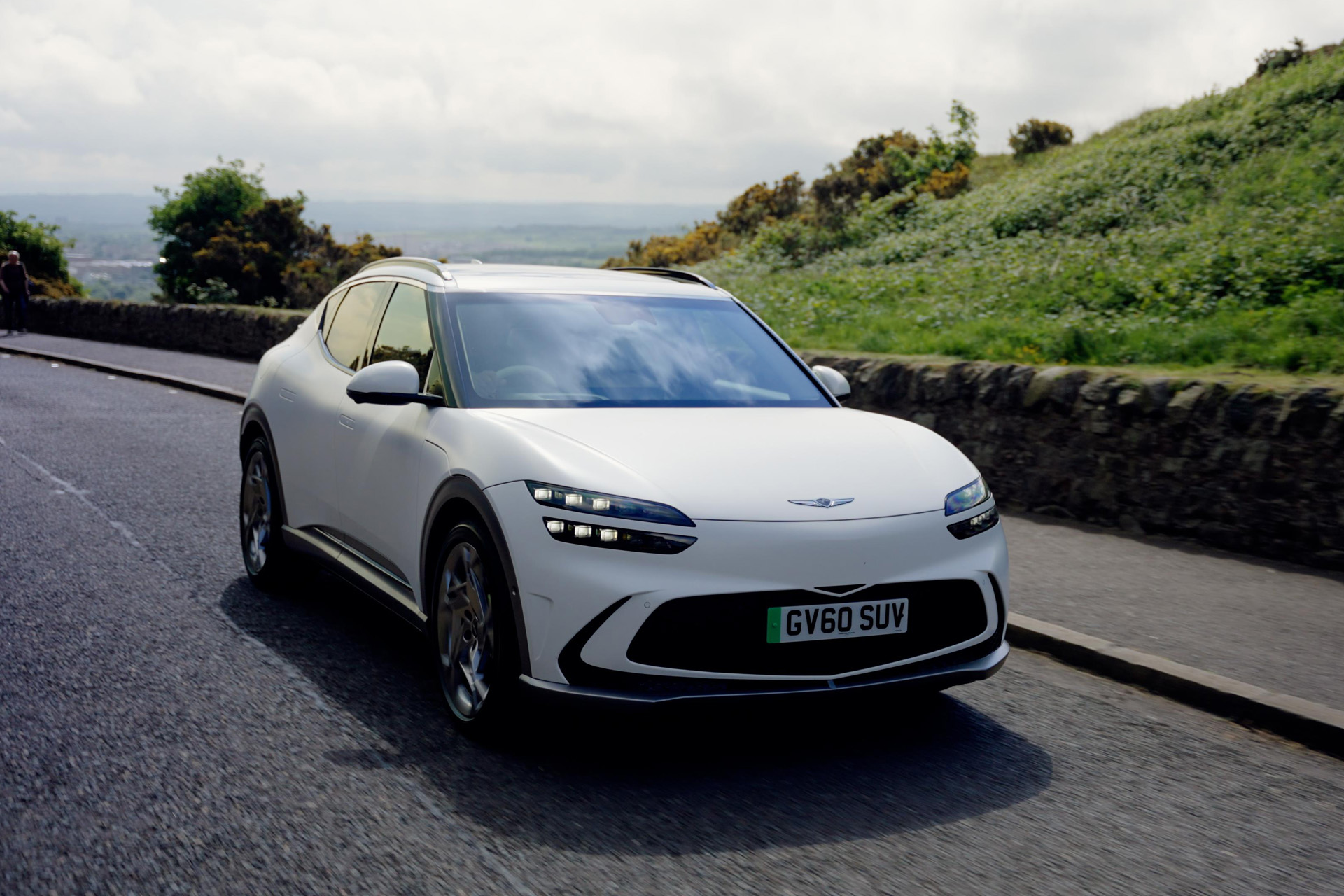 The Genesis GV60 car on a road