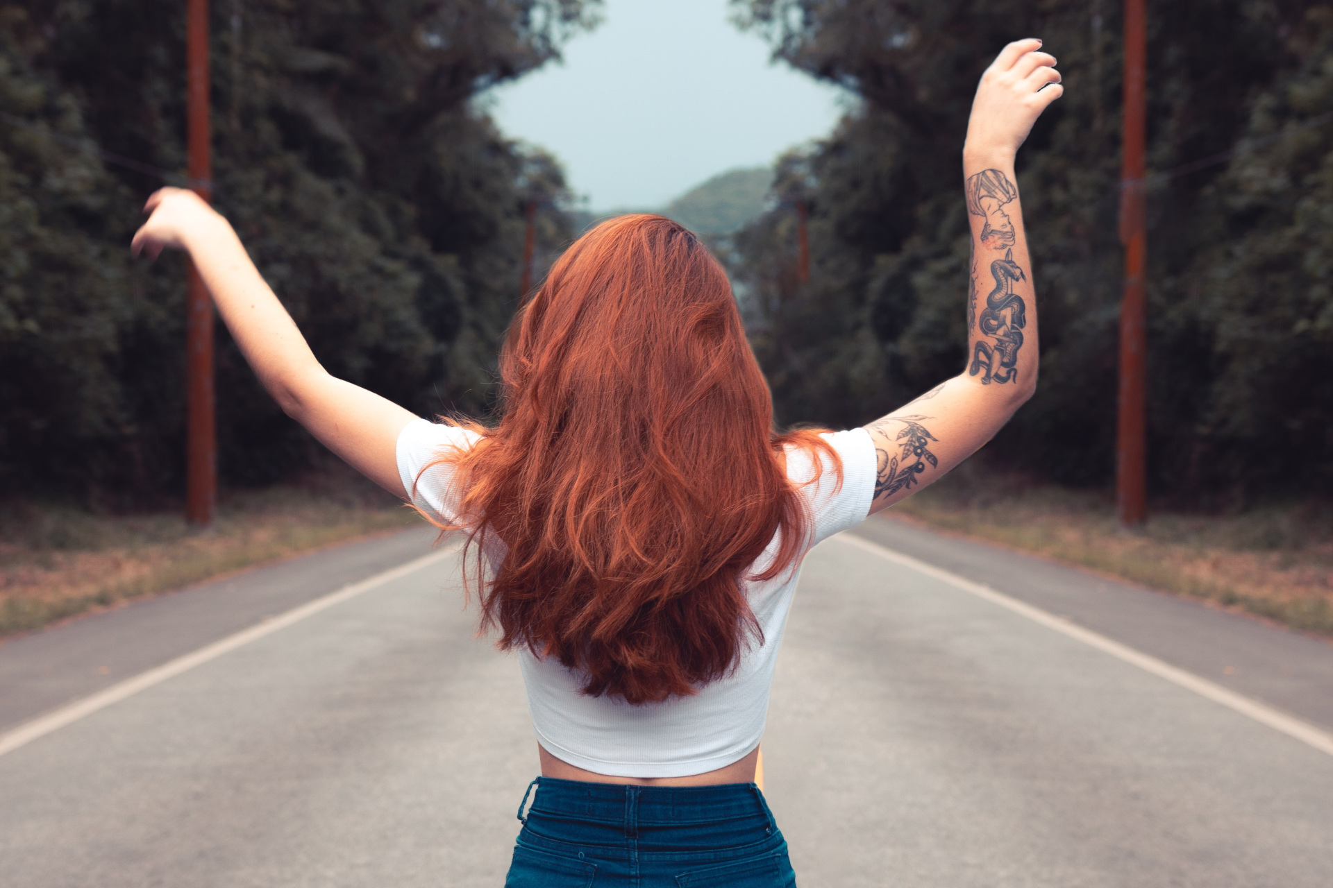 Women with red hair with back facing camera