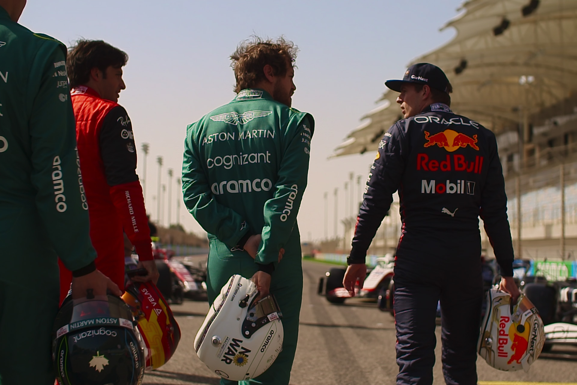 The backs of three drivers in Drive to Survive S5