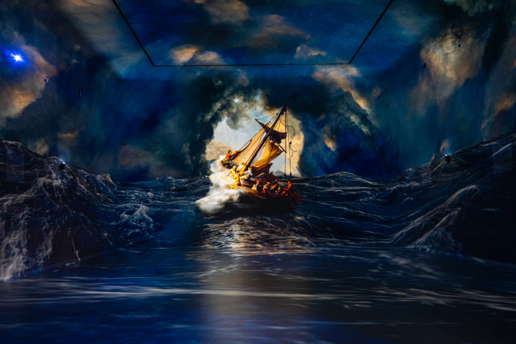 a large ship projected onto a wall