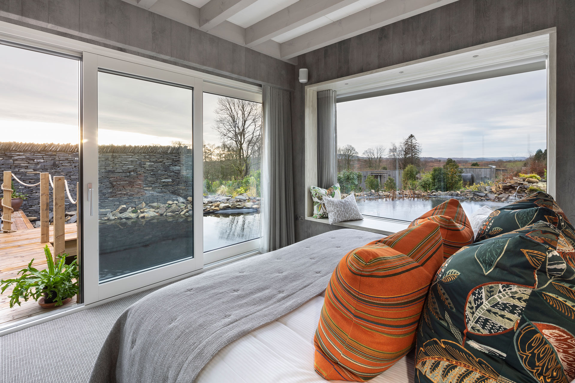 Spa suite at Gilpin, a bed looking out onto the water