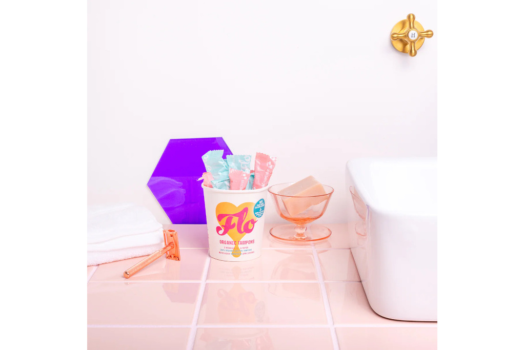 Period products on pink bathroom counter - sustainable sanitary brands
