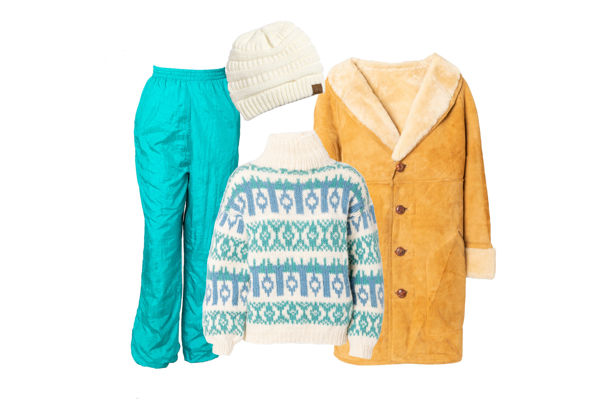 Blue ski trousers, cream hat, blue and cream jumper, beige coat