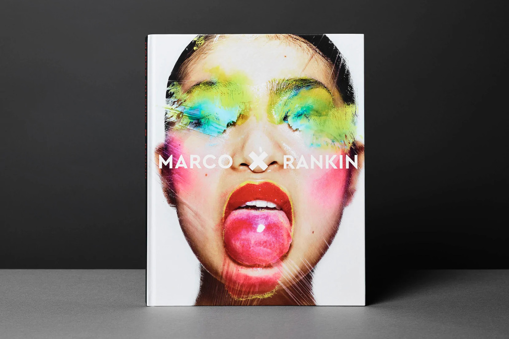 Book with woman's face covered in paint and makeup on the cover