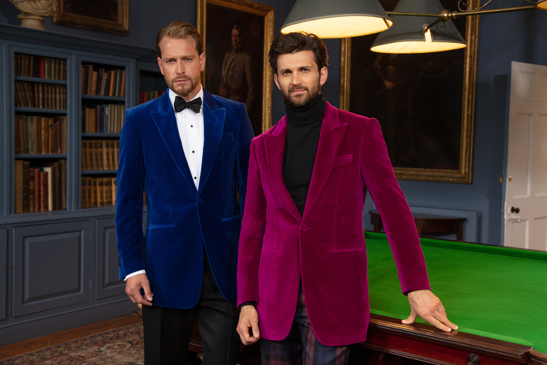 Men stood at snooker table wearing velvet jackets