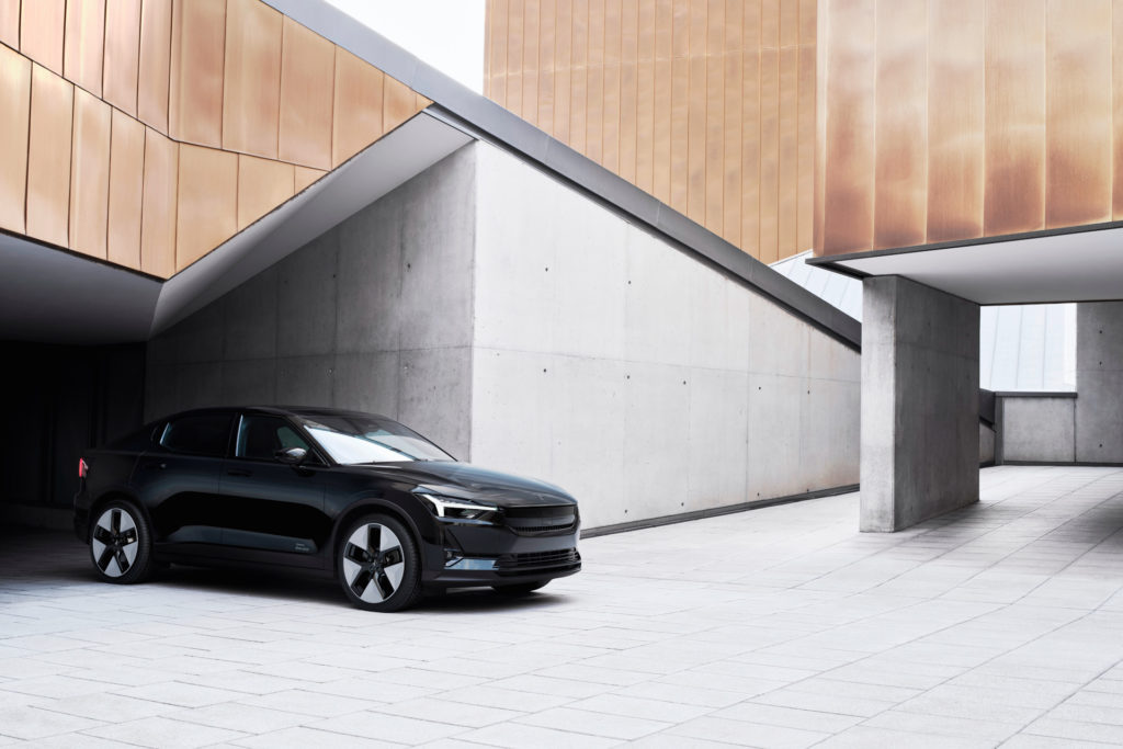 Black car in empty building courtyard