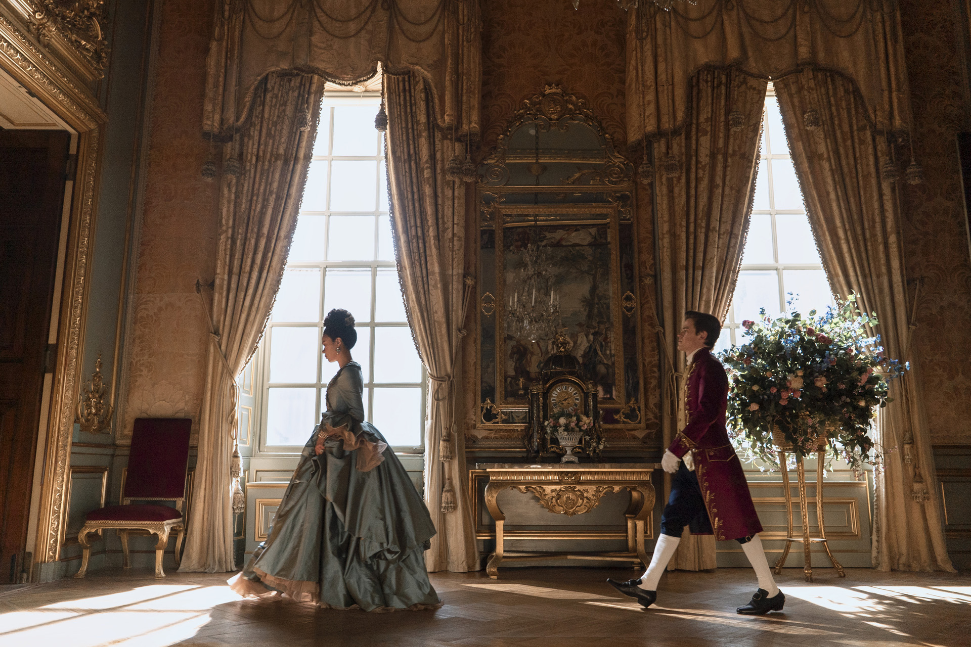 India Amarteifio as Young Queen Charlotte, Sam Clemmett as Young Brimsley in episode 102 of Queen Charlotte: A Bridgerton Story
