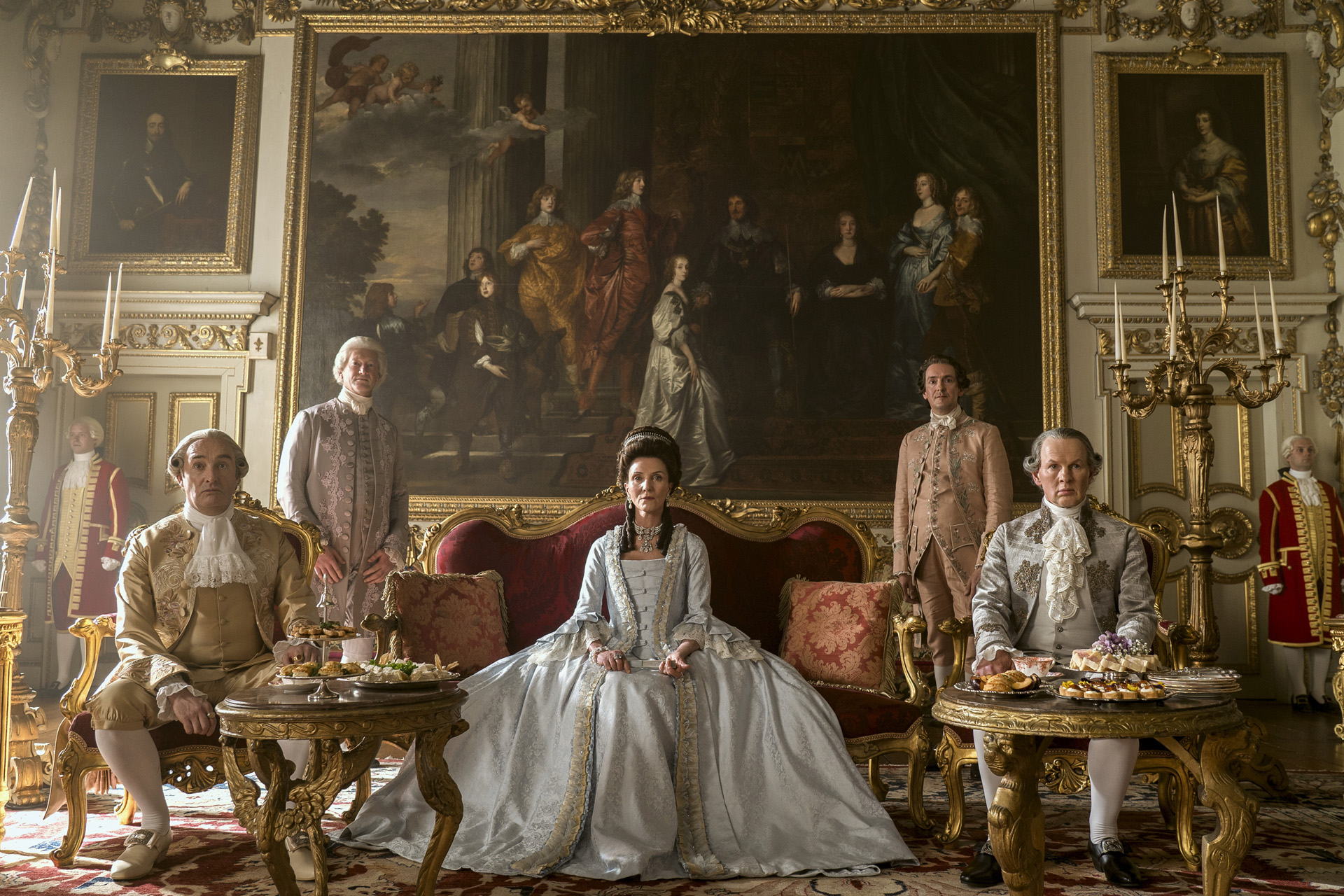 Neil Edmond as Earl Harcourt, Michelle Fairley as Princess Augusta, Richard Cunningham as Lord Bute in episode 102 of Queen Charlotte: A Bridgerton Story