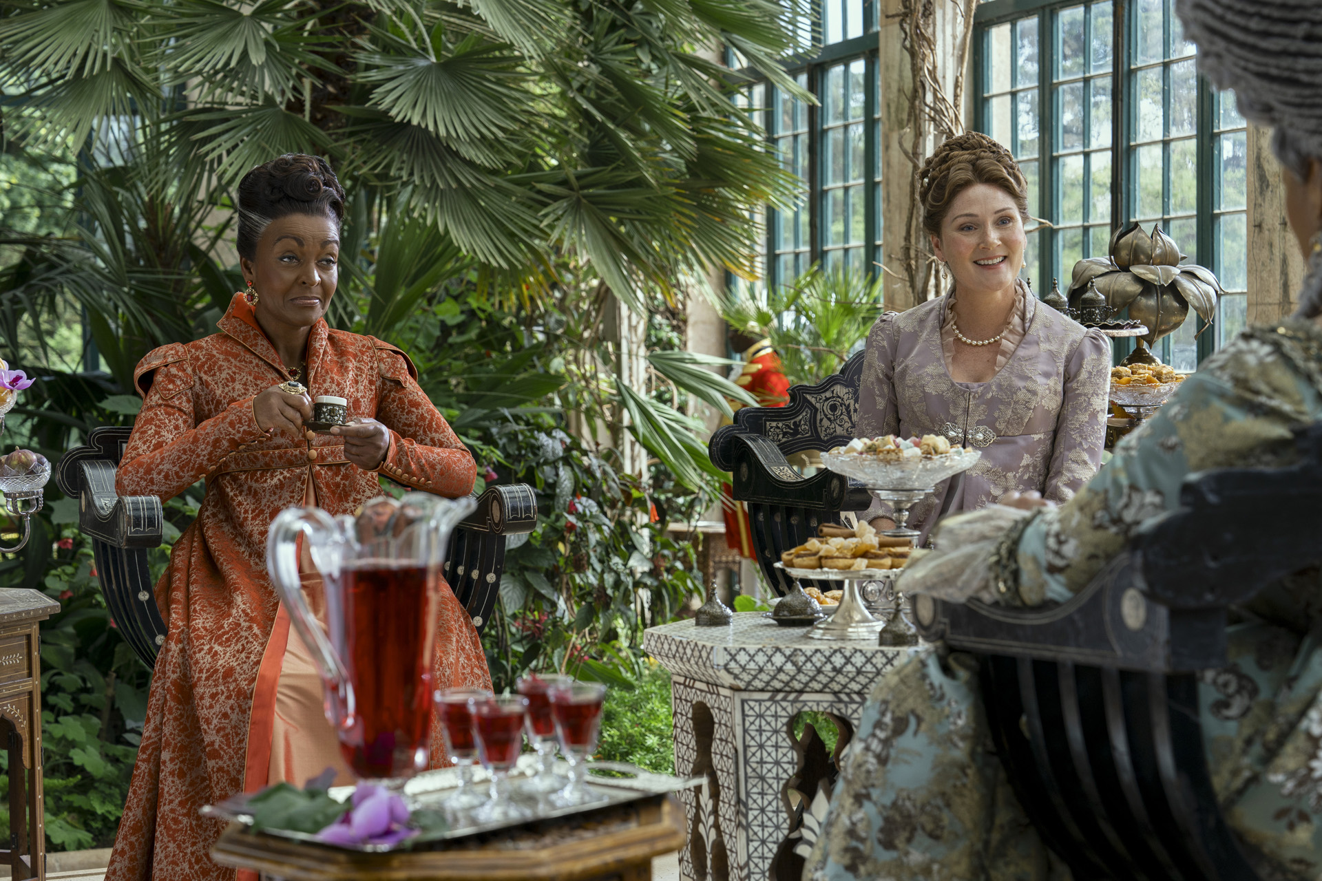 Adjoa Andoh as Lady Agatha Danbury, Ruth Gemmell as Lady Violet Bridgerton in episode 102 of Queen Charlotte: A Bridgerton Story