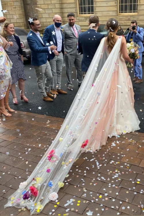 Bride wearing colourful floral veil