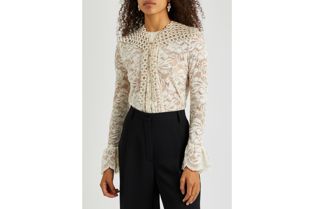 Woman in floral shirt with pearl shawl