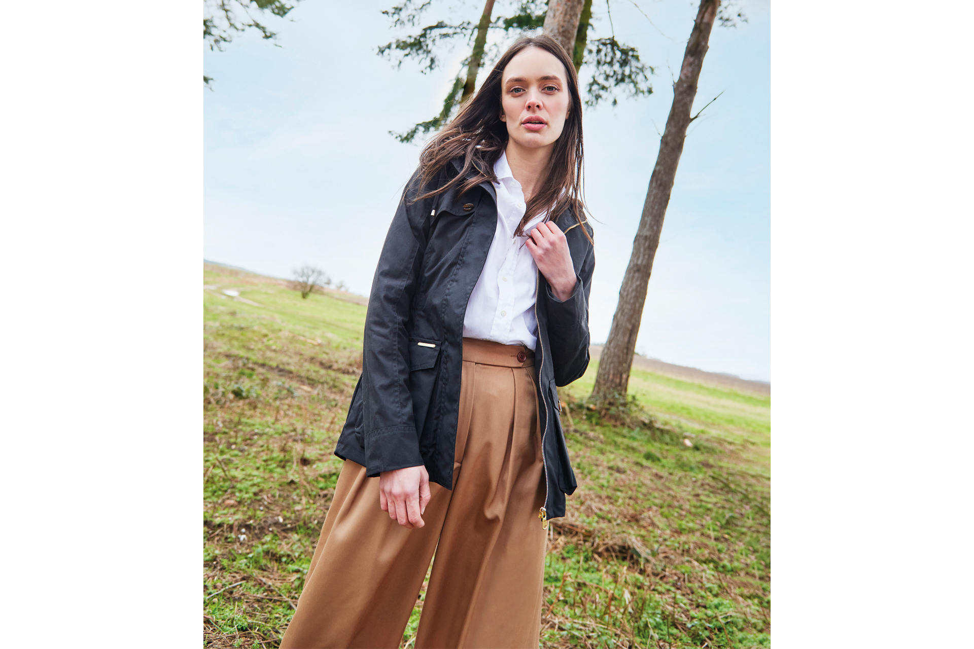 Female model in field wearing Troy London clothes