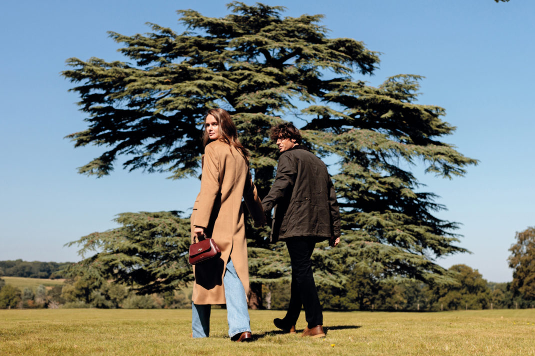 Man and woman walking in field