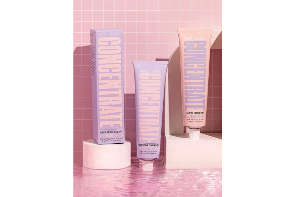 Pink and purple bottles on pink tile background
