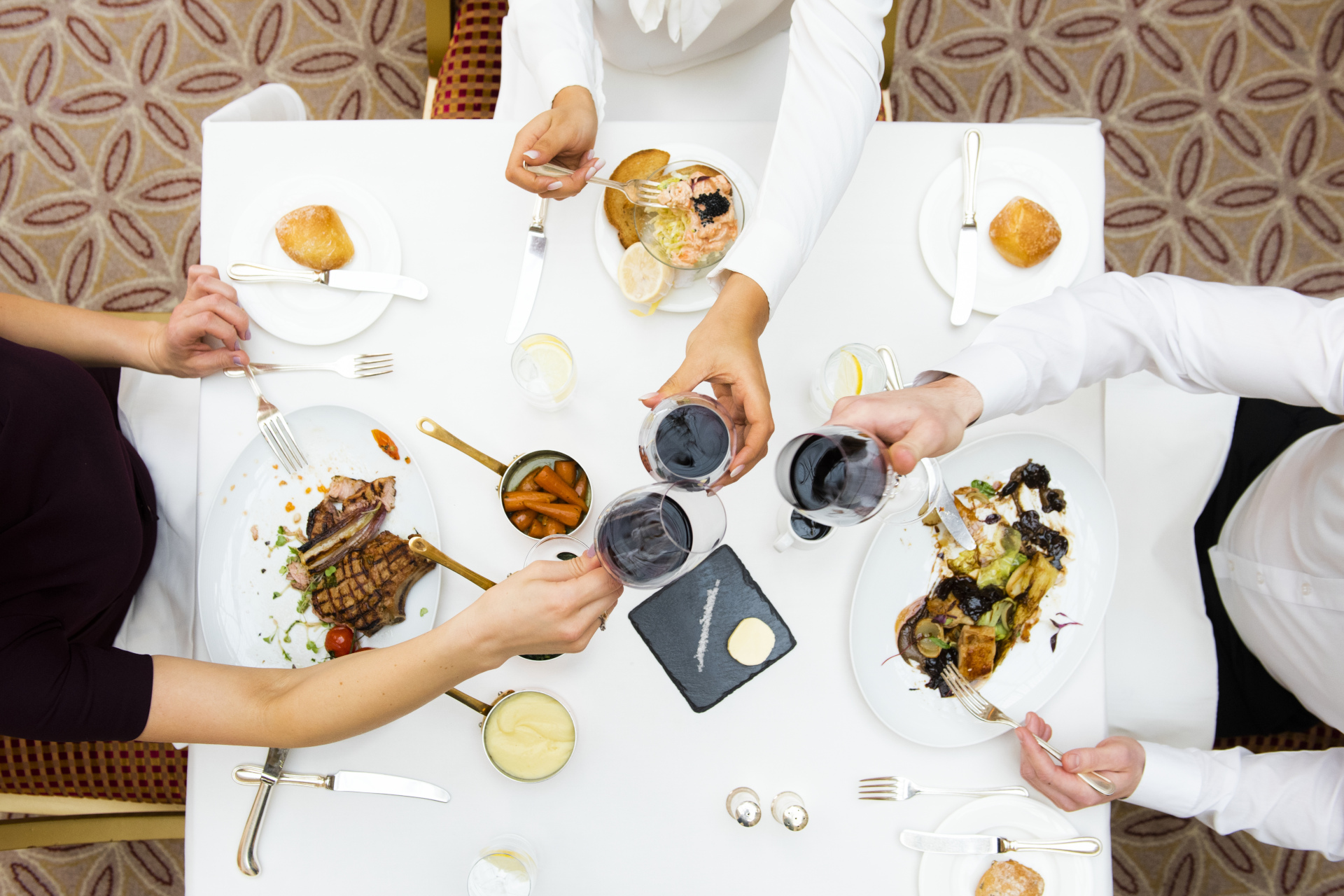 Overhead view of people sat to eat dinner