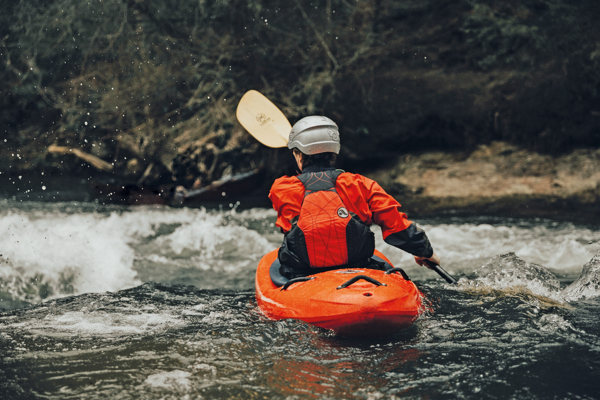 Person paddling on a river