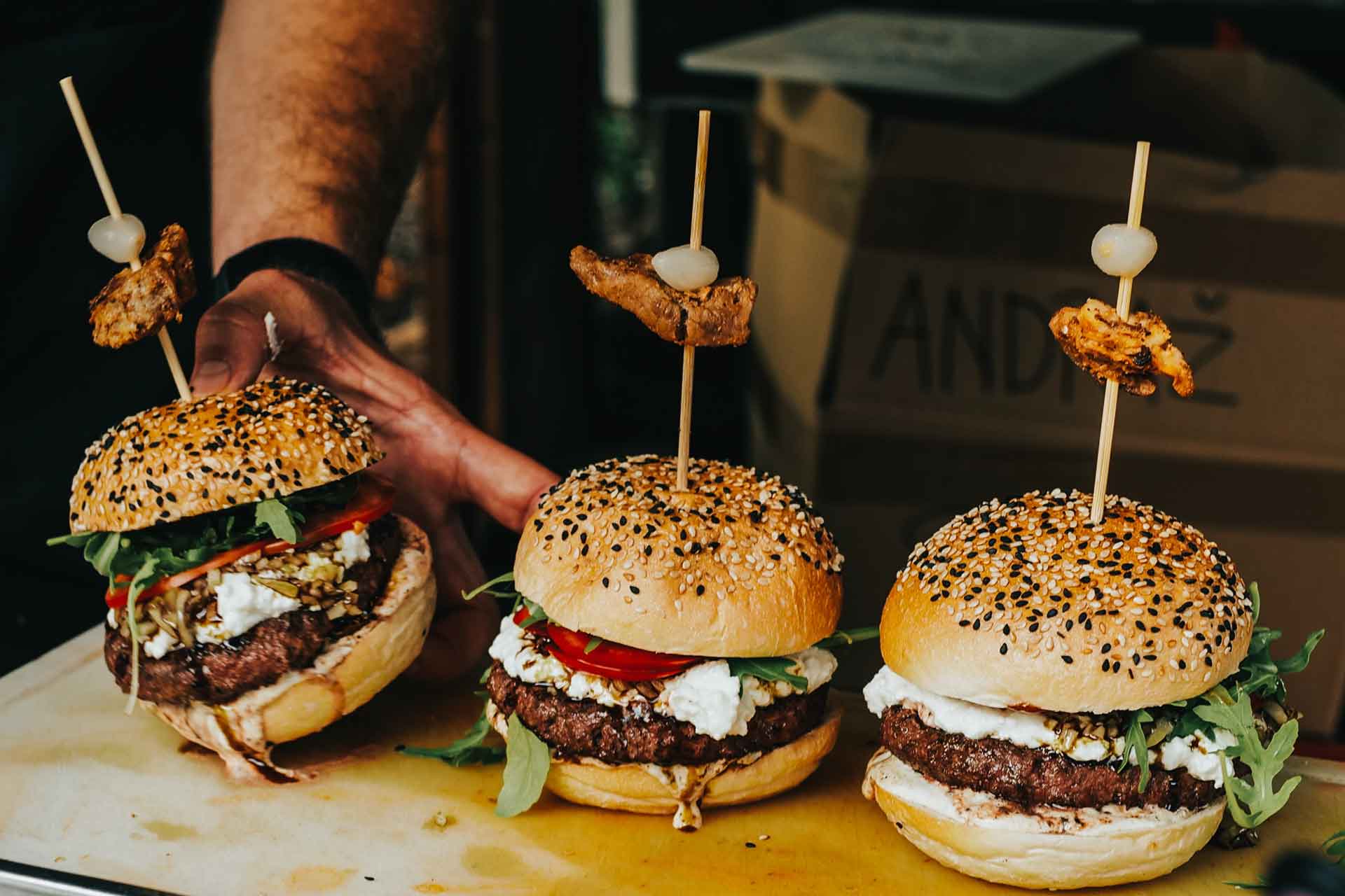 person holding burgers