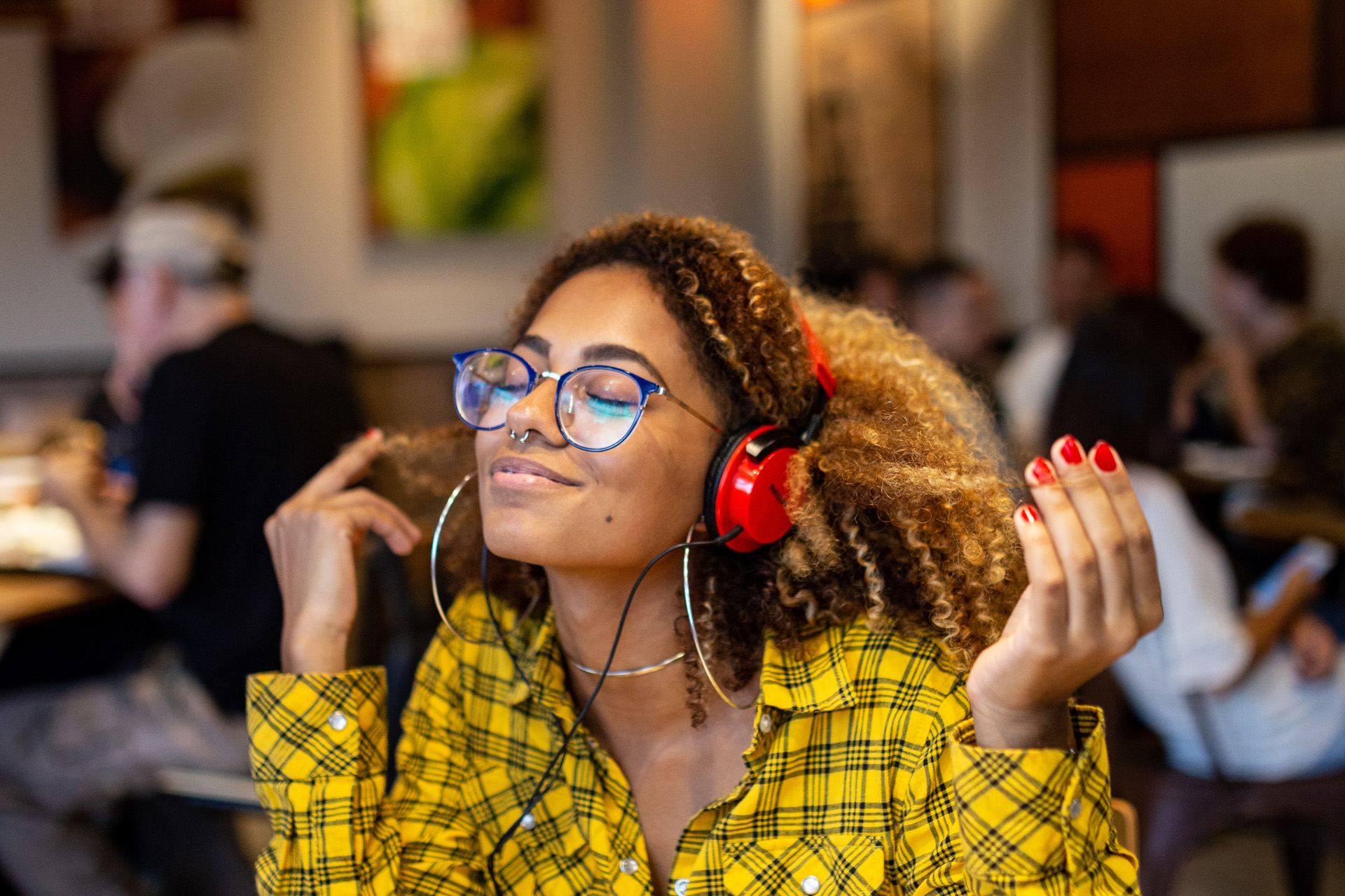 A woman listening to a podcast