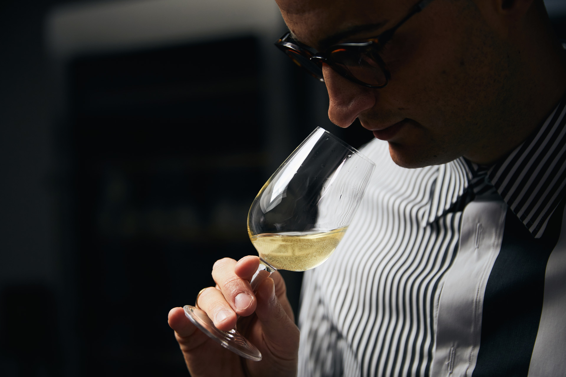 Daniel smelling wine