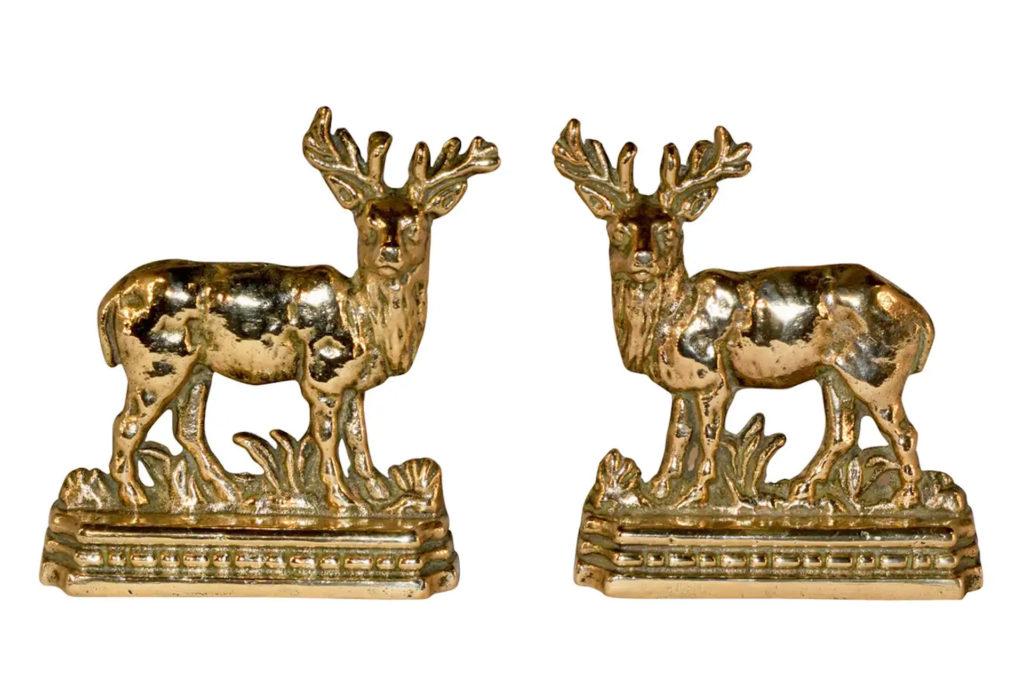 Two cast brass stag mantle decorations