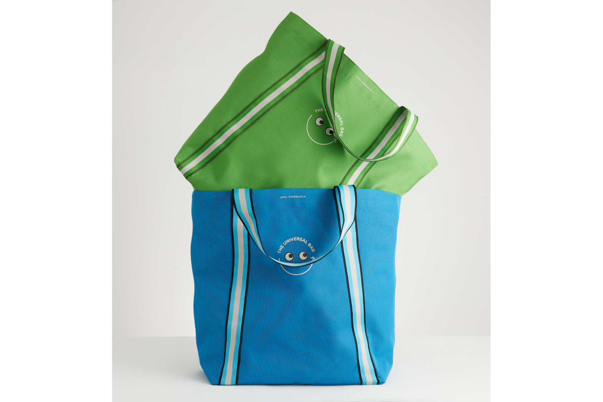 Green and blue bag stacked on top of each other