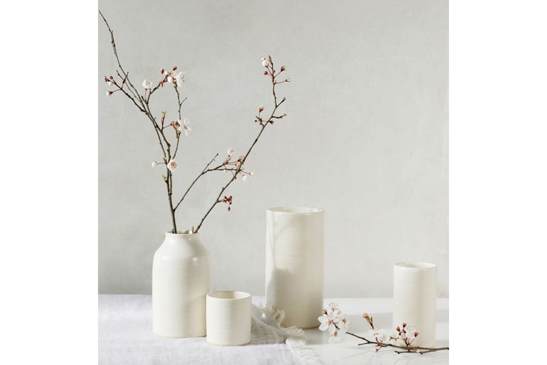 Tall white glazed vases.