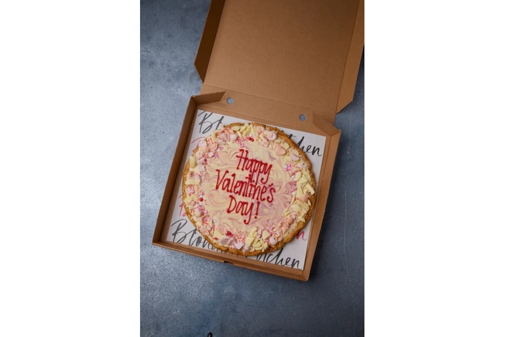 Box with Valentine's themed cookie inside