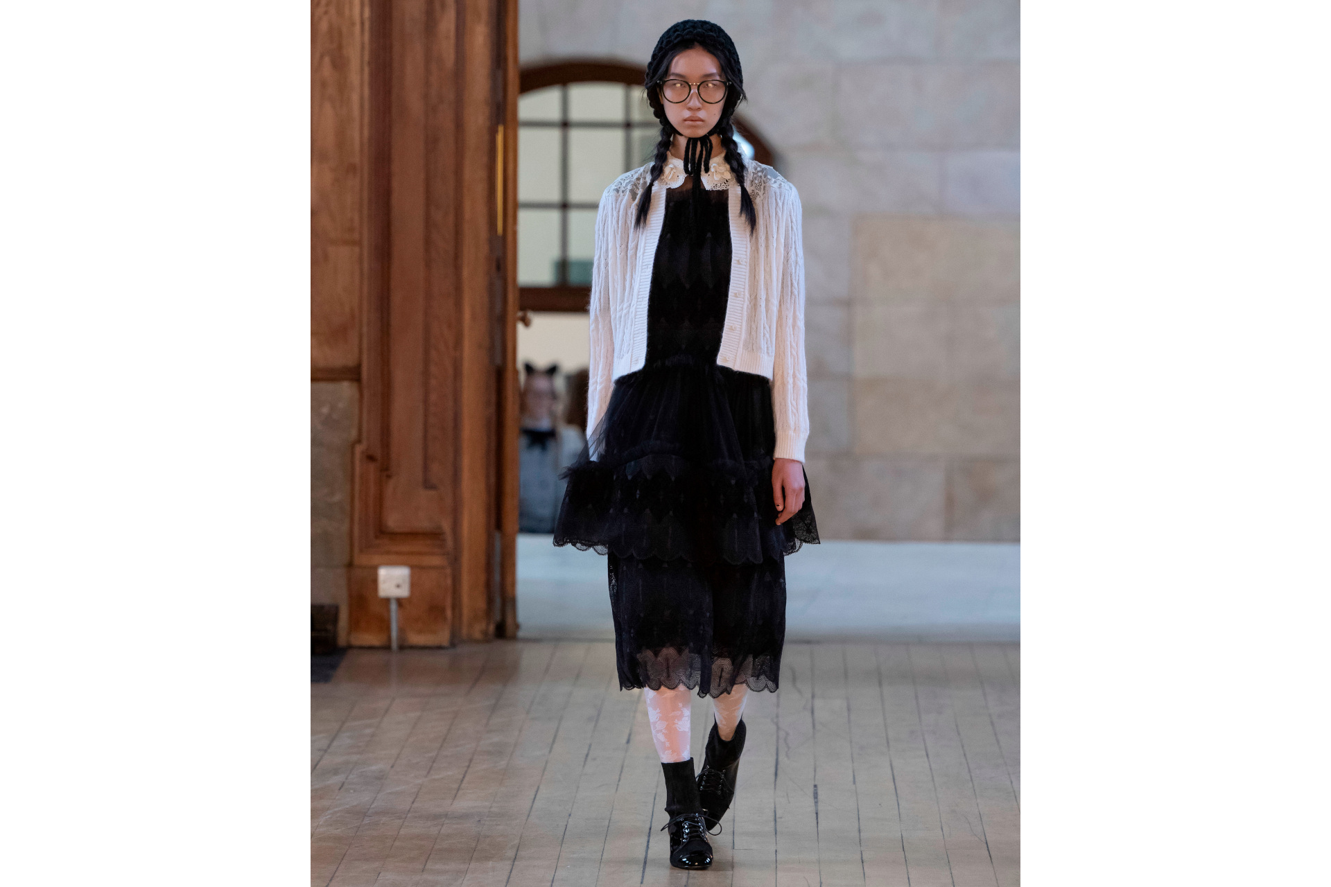 Woman in black and white outfit
