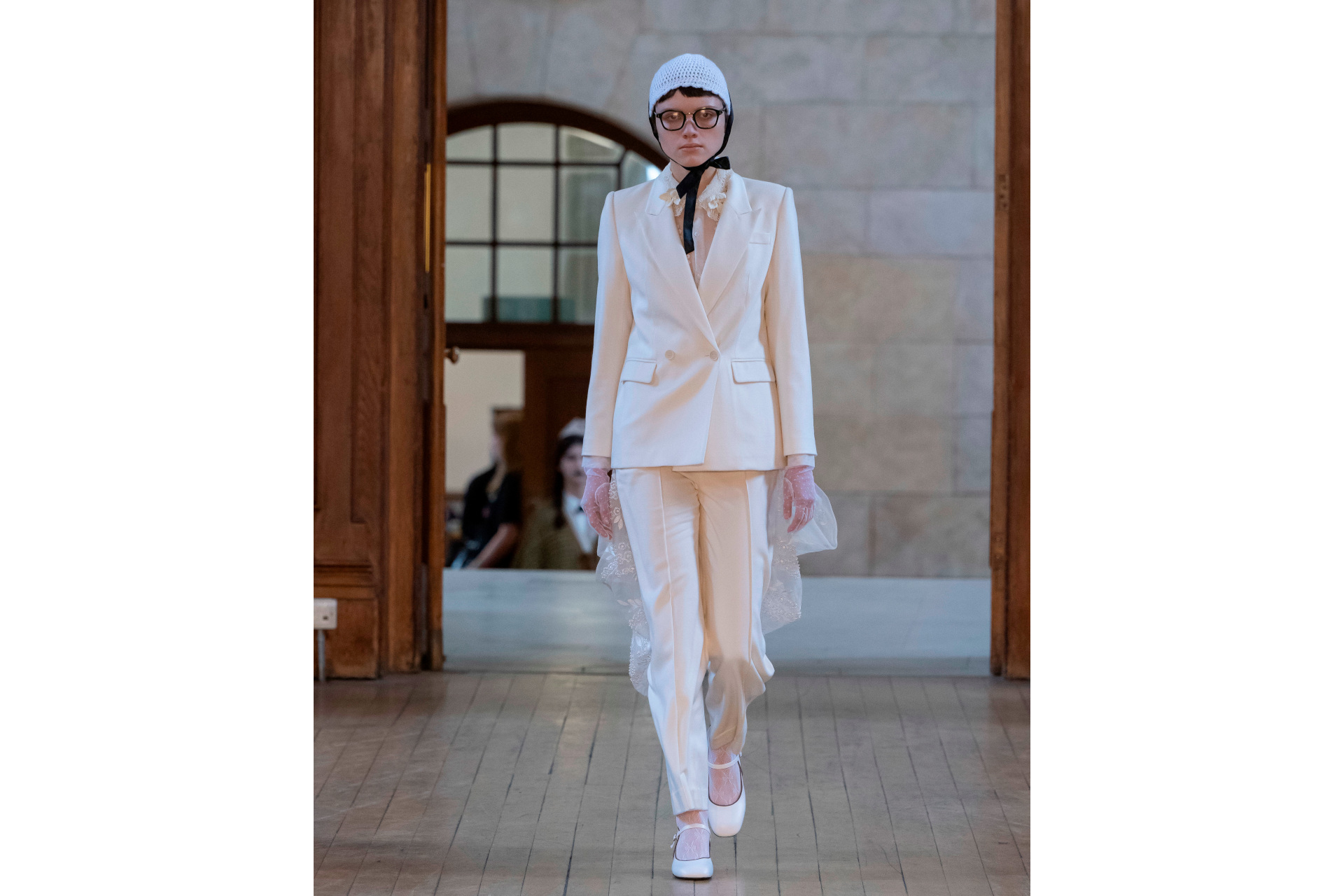Woman in white suit