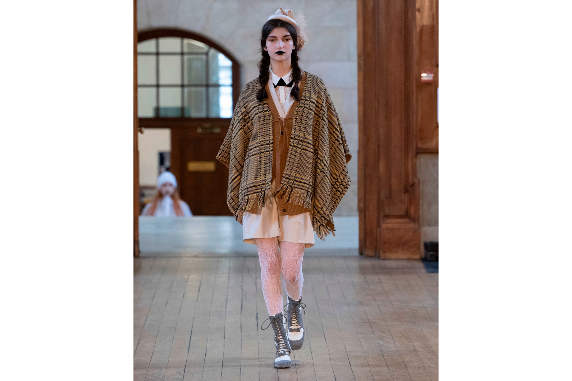Woman in brown coat