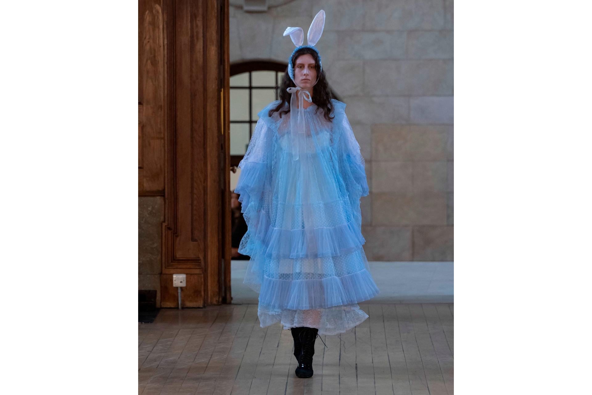 Woman in blue tulle dress with matching bunny ears