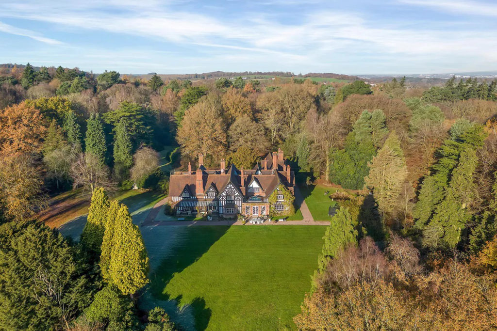 Old manor house surrounded by woodland