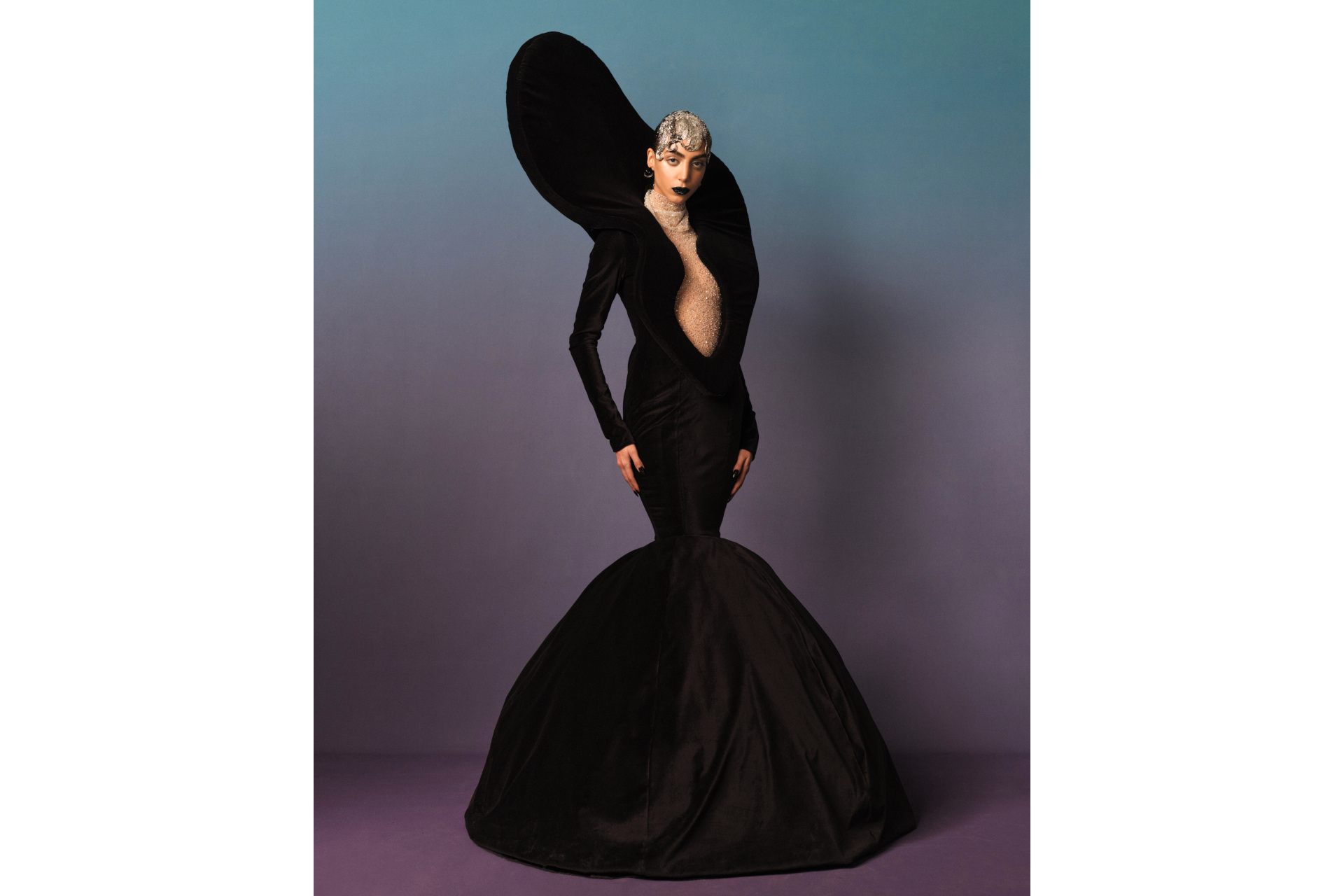 Woman in black dress and headpiece