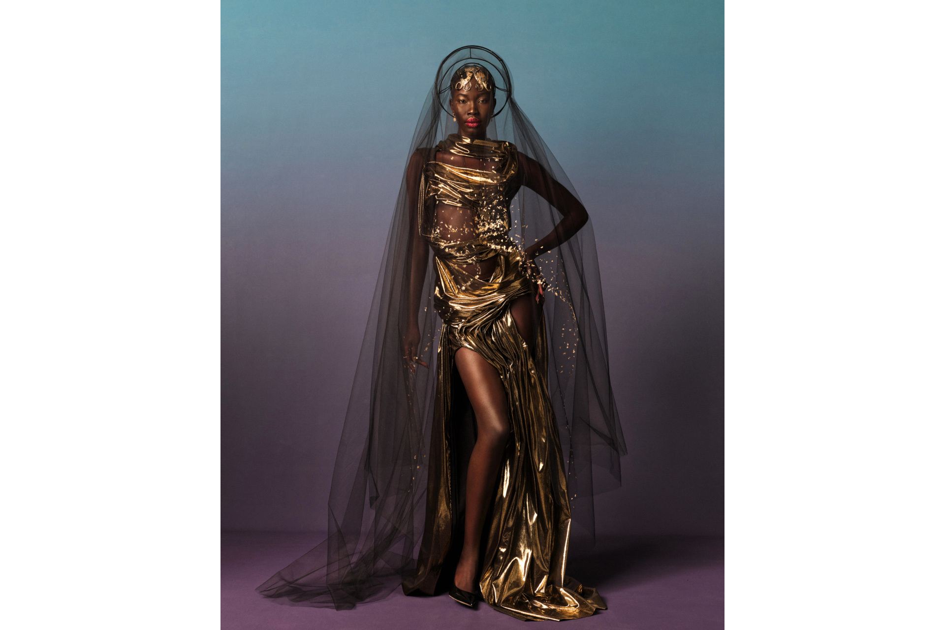 Black model in gold dress and black veil
