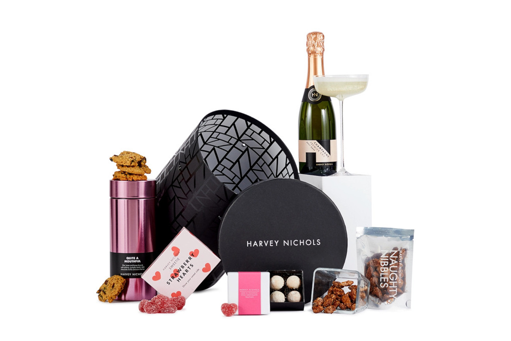 Black box with drinks and chocolates set up around it