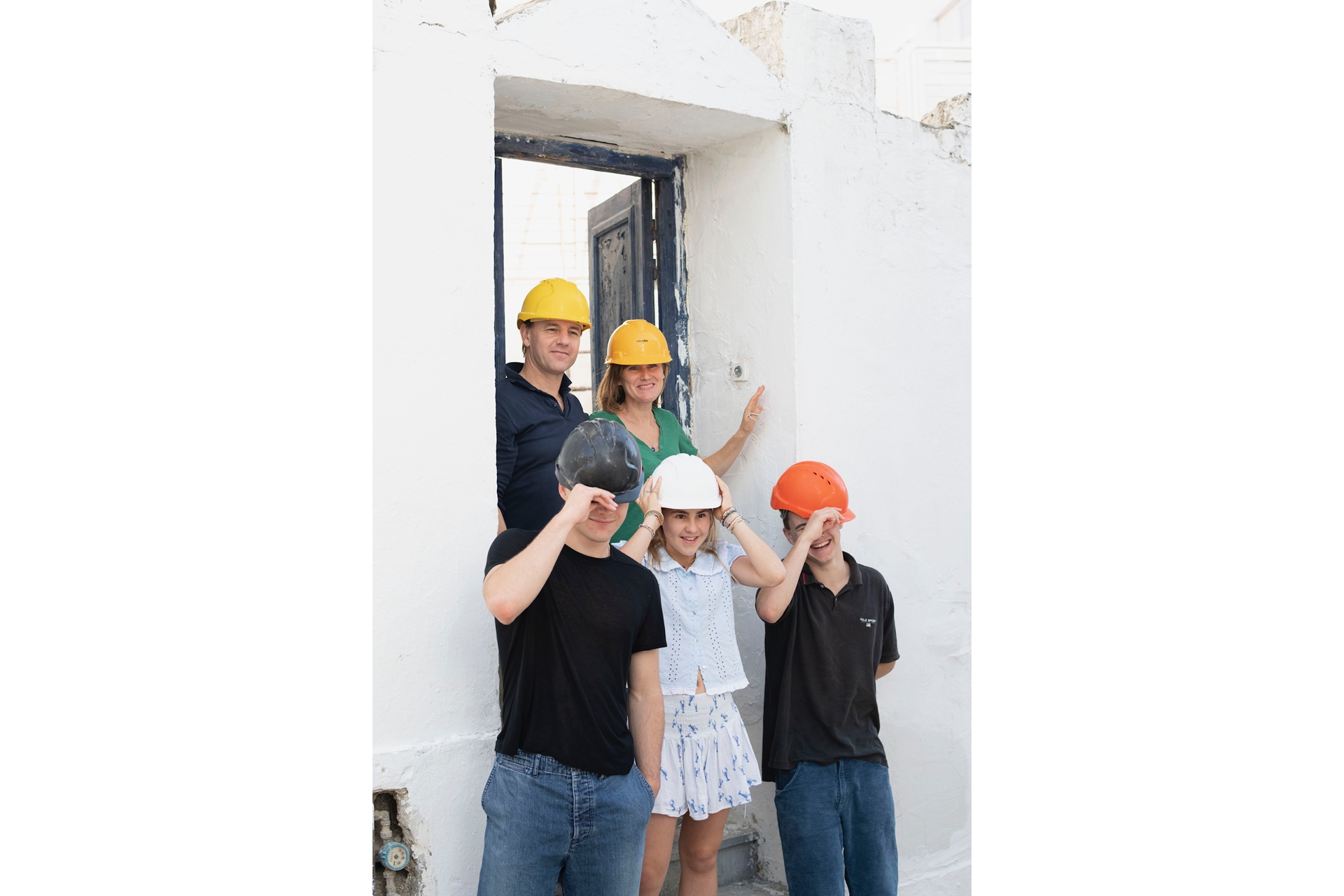 Sarah Moore and her family on the building site