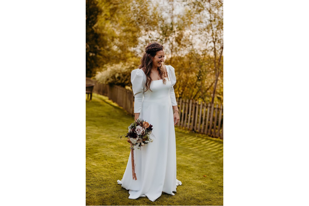 Woman in white dress with puff sleeves