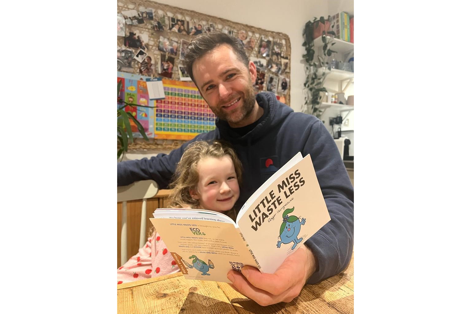 Harry Judd with his daughter reading Little Miss Waste Less