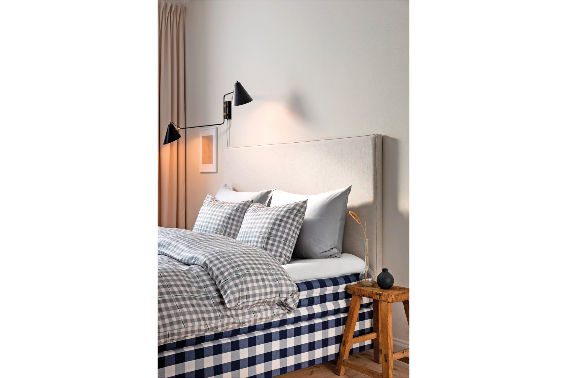 A bed with a quilt on top