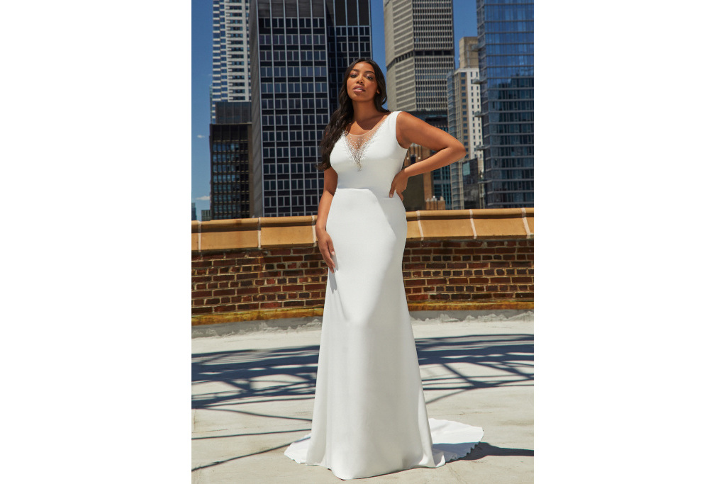 Plus-sized woman stood in wedding dress