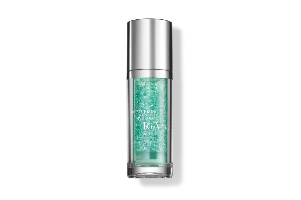 Clear bottle with green liquid inside and silver cap