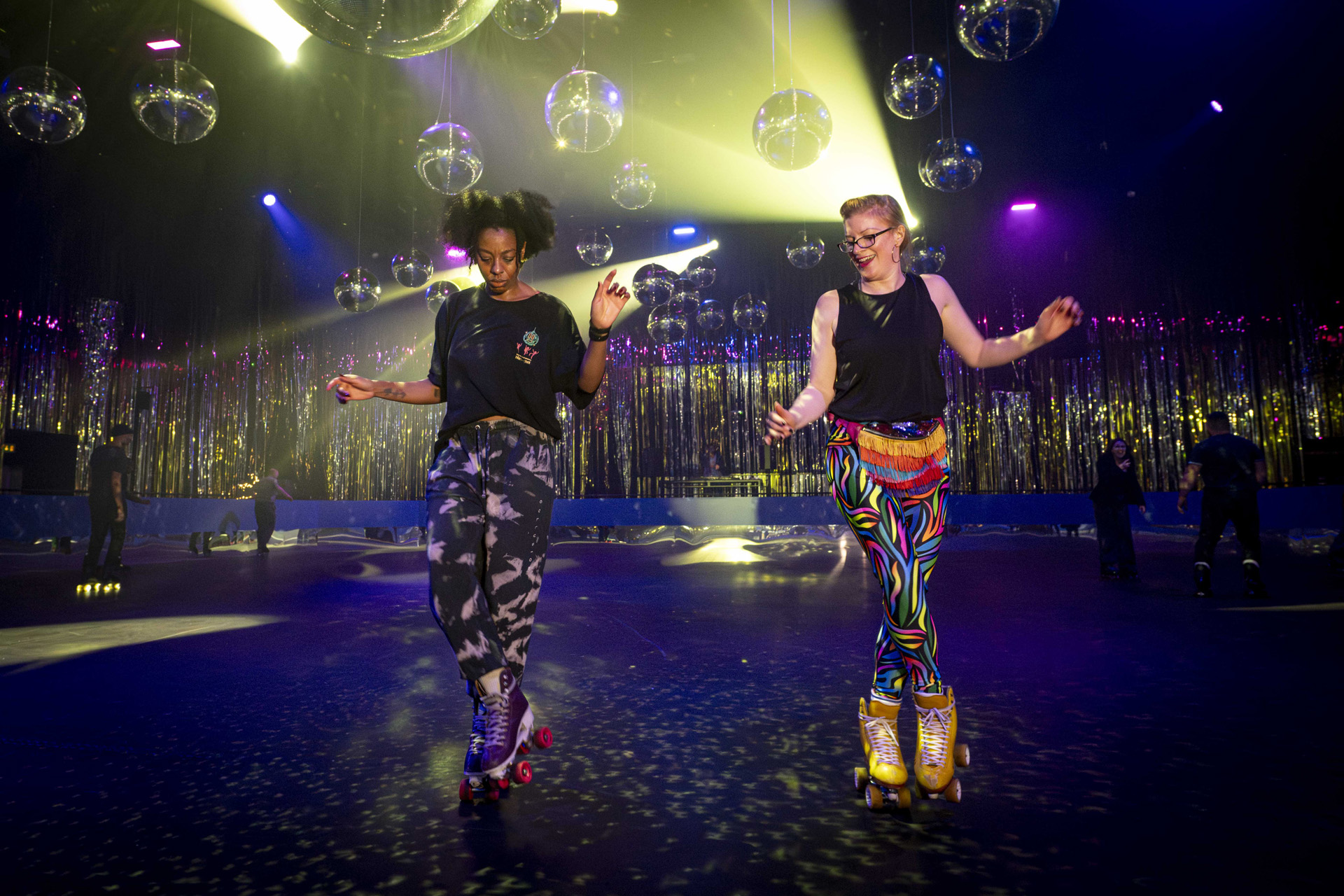 Two people rollerskating